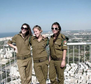 Maayan Sherris (center) and her friends from the Israeli military pose in their uniforms at a viewpoint in Tel Aviv overlooking the Mediterranean Sea. (Maayan Sherris)