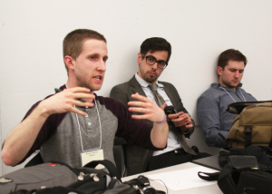 During The University for the New Economy panel, Environmental Studies major Nic Sheehan explains how students can radicalize their school’s economics program. (Lindsay Peters)