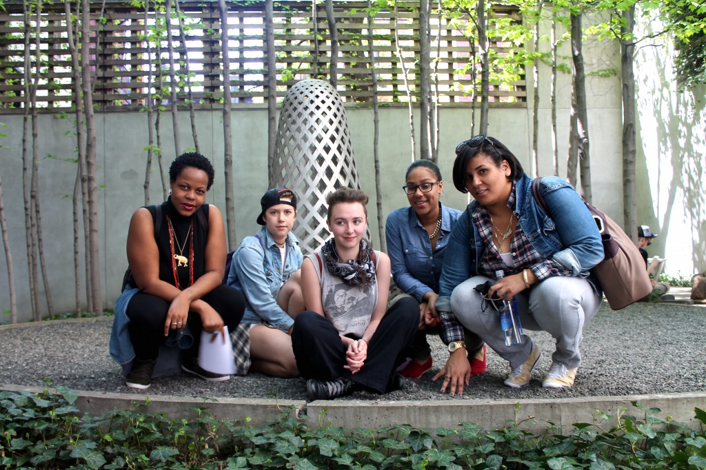 Student activists raise awareness of racial erasure in the Lang courtyard. 