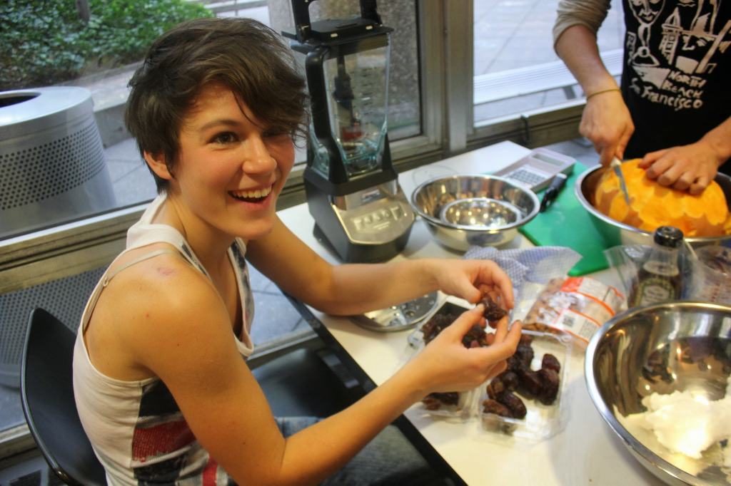 Liz McMillan and Martina Farlli, a visiting student from Italy, converse over the differences between slow food in Italy and America while making a salad dressing.