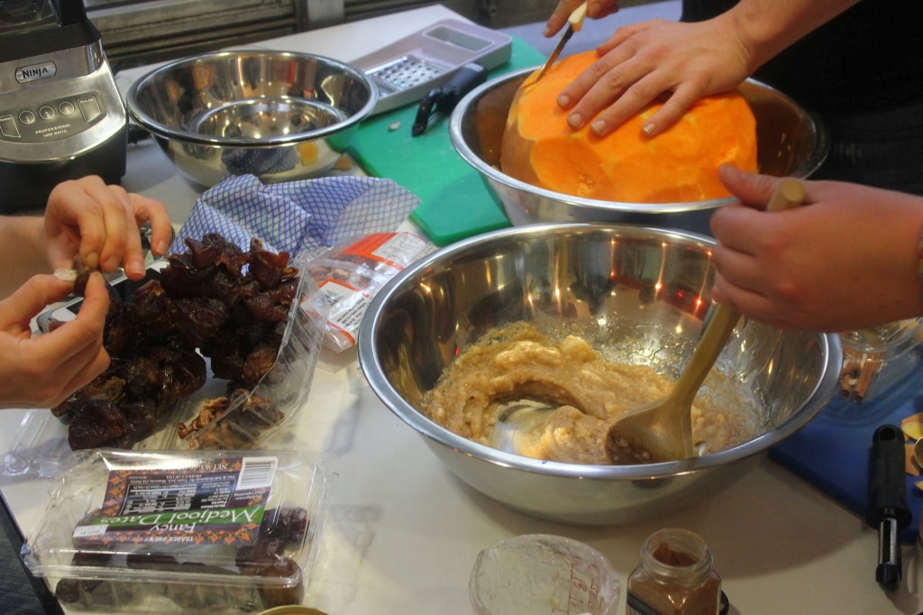 Students mixed dates, cinnamon, coconut oil, and pumpkin to make a delicious raw, vegan, pumpkin pie.