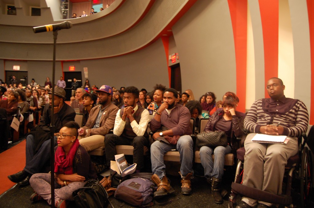 Students listen intensely to bell hooks and Eve Ensler as they discuss the politics surrounding colored women’s bodies.