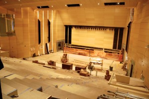The multi-purpose auditorium nearing it’s completion. The space has been designed to seat 600 to 800 people. Each wall panel is created to amplify the acoustics of the room. Photo by: Shea Carmen Swan