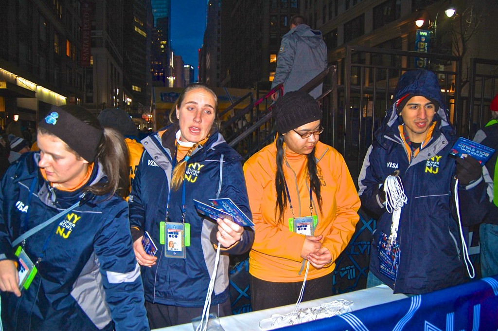 Staff hands out free badges that allow participants to scan their cards at each tent, keeping track of all the activities they have completed.