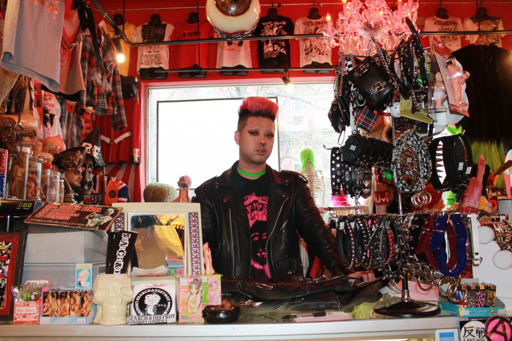 A Search and Destroy employee stands with some of the store's merchandise.