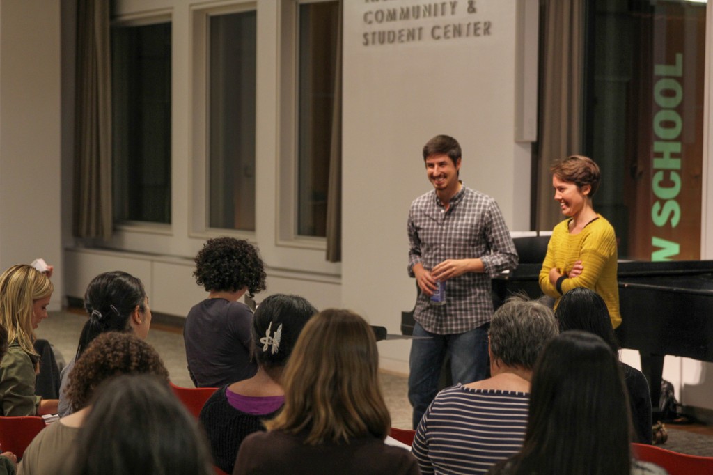 Choir leaders Eric Dudley and Caroline Shaw talk to singers at a recent meeting.