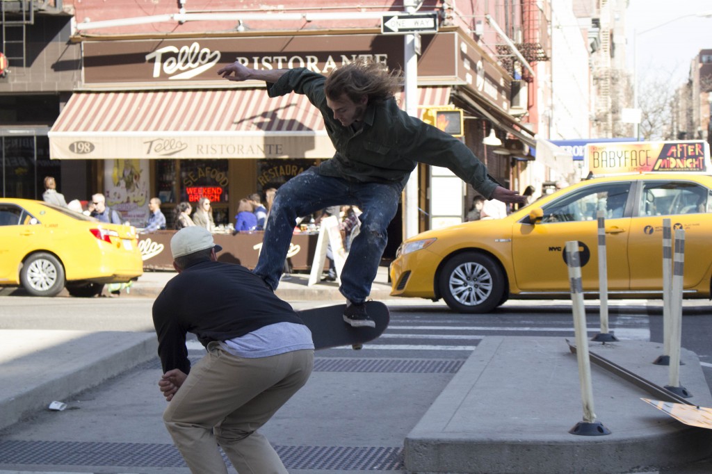 Skateboarders made the block their home during a warm Sunday afternoon to record themselves doing a trick using a broken street sign and a curb. Dont try this at home folks. 