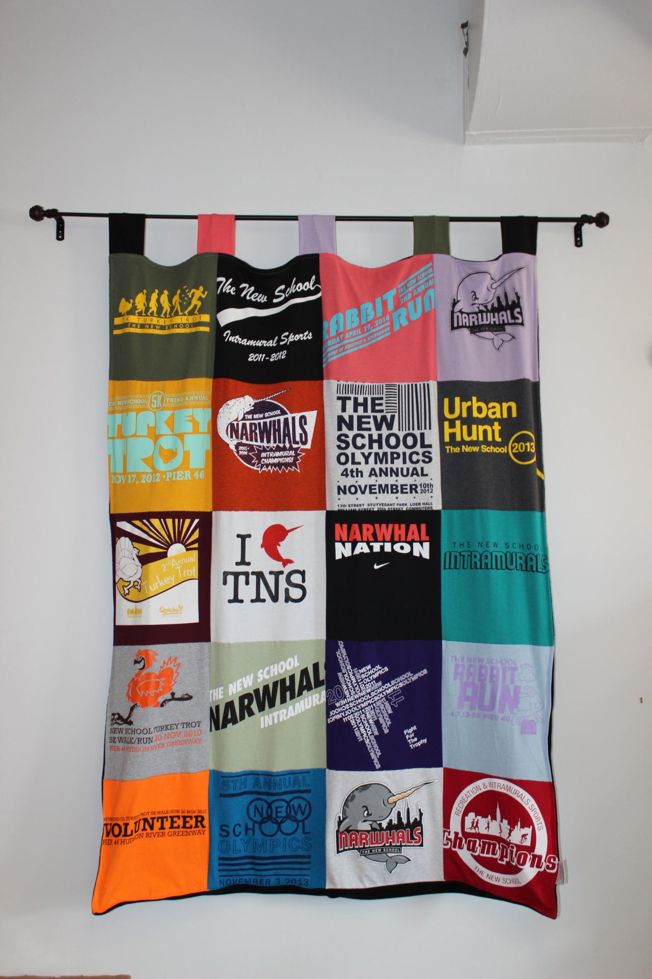 A quilt made of tshirts from past New School events.  Photo by Mallory Everett