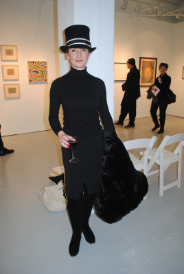 Lisa Carey, old enough, a milliner from New York, New York, wearing one of her creations.
