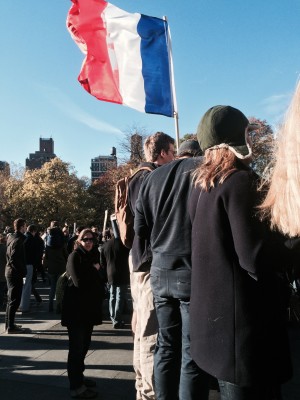 Supporters hold up a French flag at the #NewYorkIsParis rally in Washington Square Park on Nov. 14. 
