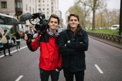 Finn (right) and Jack (left) shoot their climate change documentary during a march at the end of November in London. Photo Courtesy of Finn Harries.