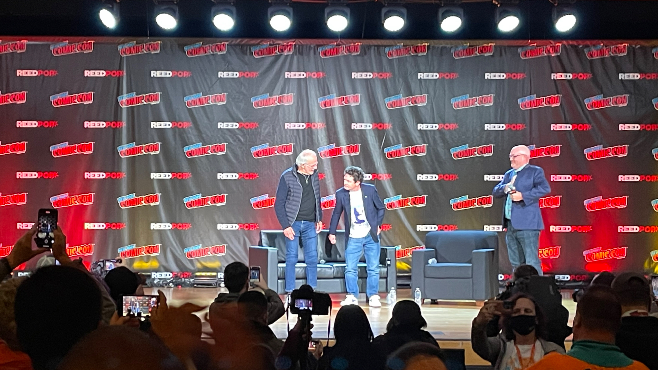 Michael J. Fox and Christopher Lloyd take a bow at the Back to the Future reunion panel at NYCC on October 8 at the Javits Center.