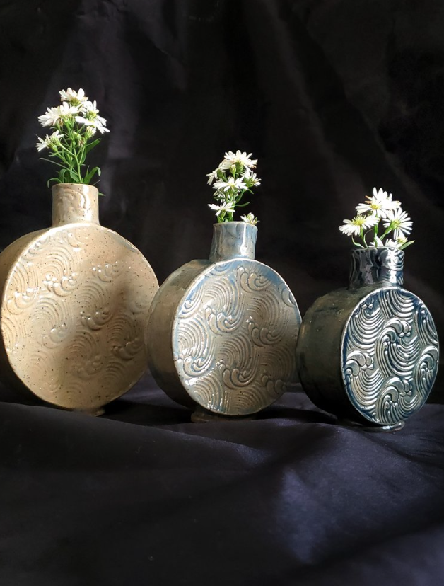 A set of three vases created by Angela. 