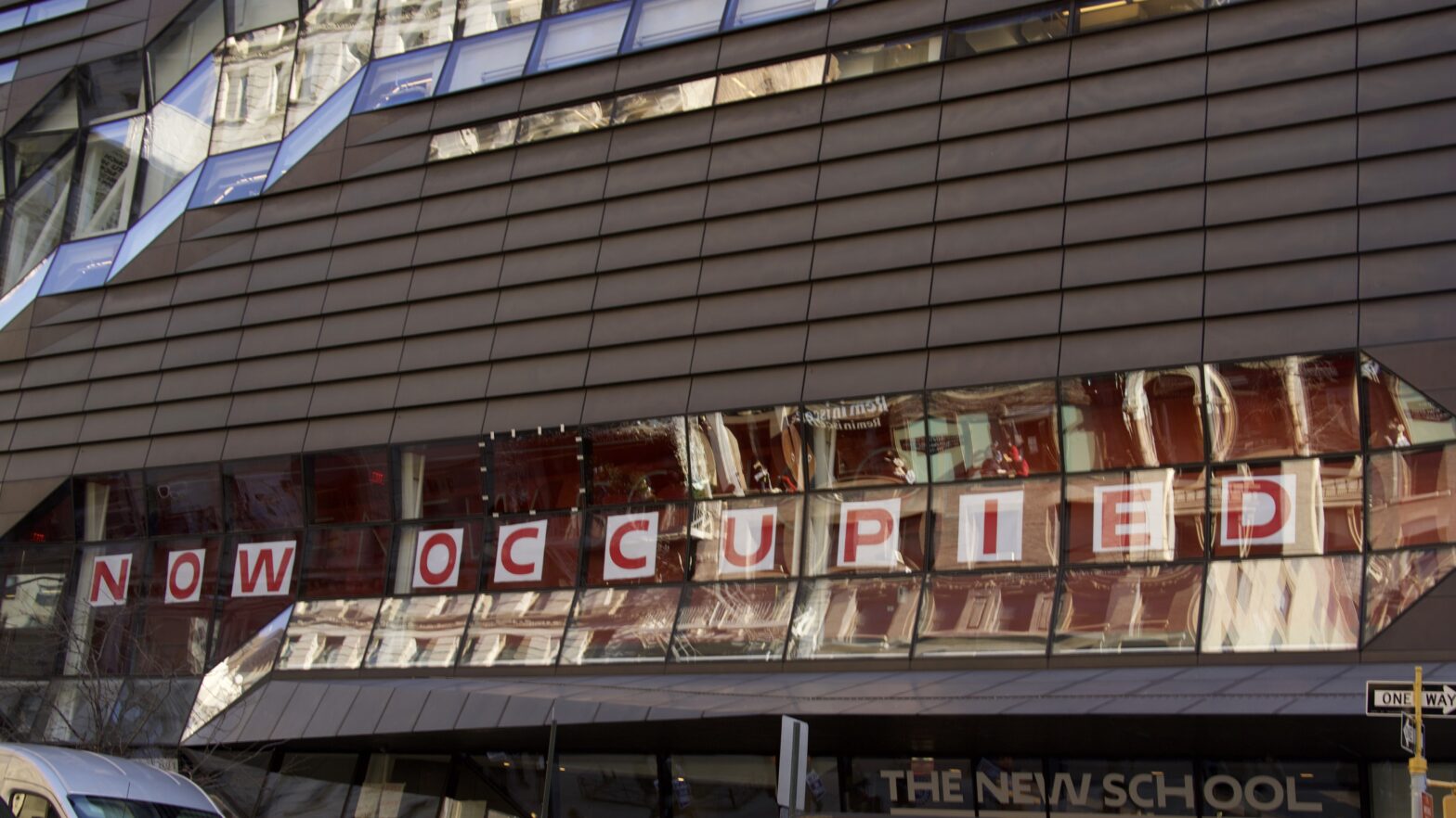 Signs posted at The New School University Center read “now occupied.”