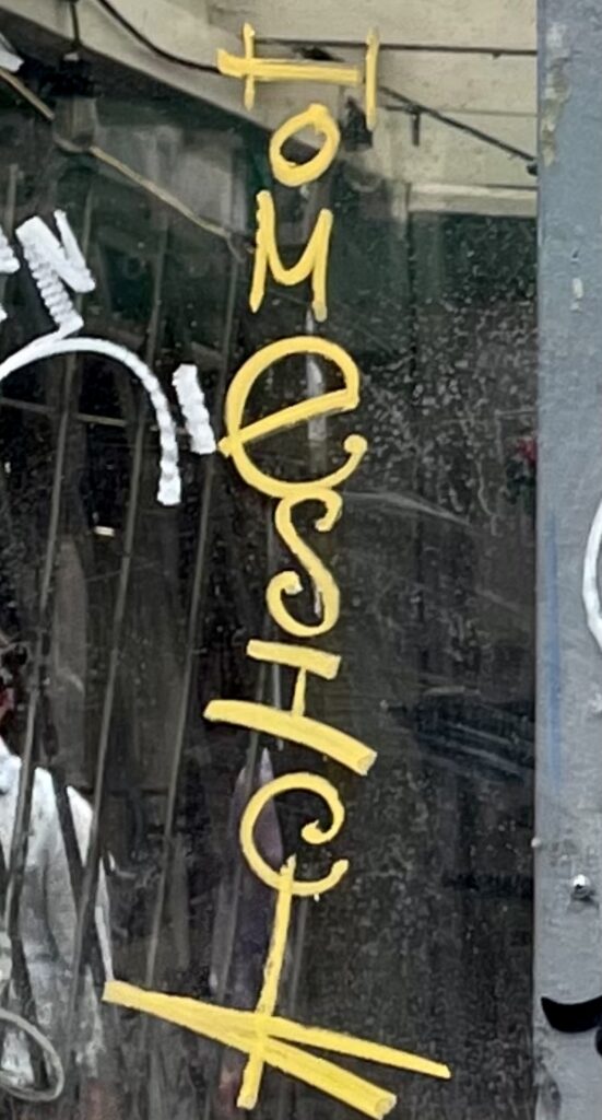"Homesick" written vertically in yellow handwriting