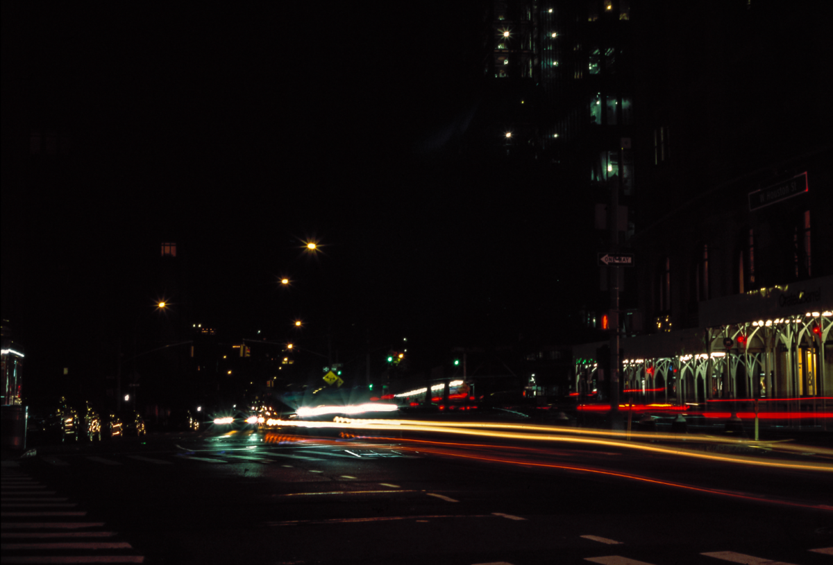 Photograph of cars in New York City at night