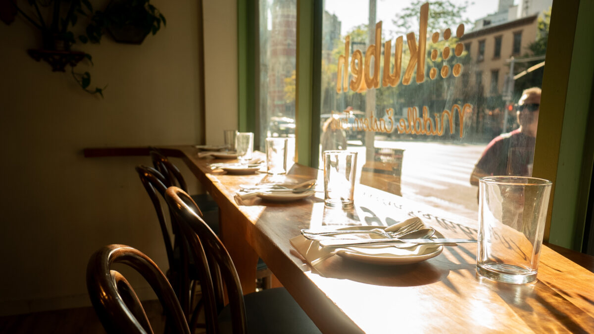 Bar seating in front of a window.