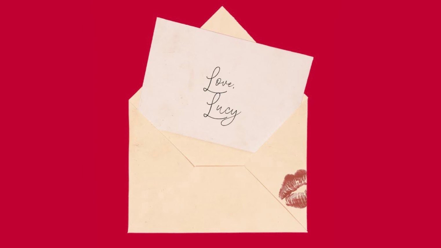 Open paper envelope with card that reads "Love, Lucy