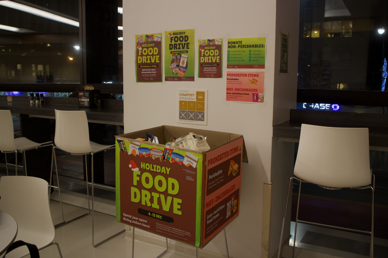 Food Drive box with posters above it.