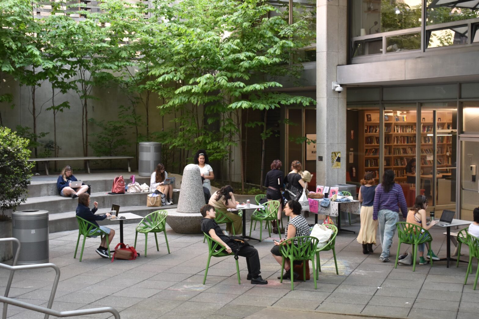 Students sitting, conversing, and studying in Lang Courtyard.