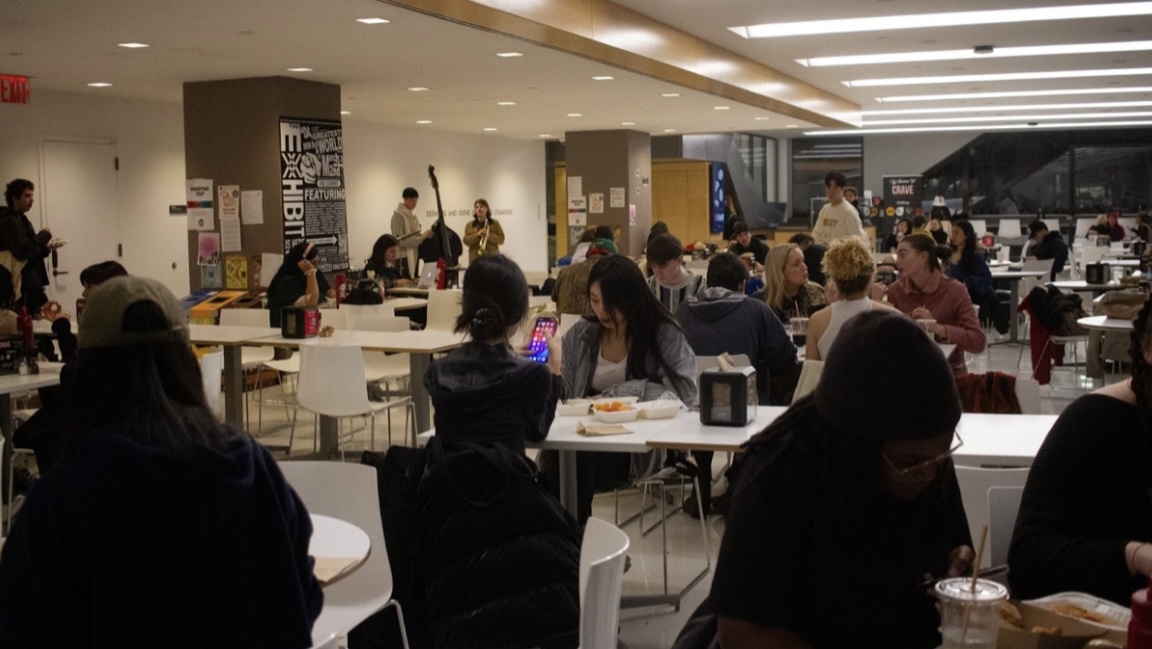Students flooded the cafeteria with free food in their hands and found seats alongside unfamiliar faces.