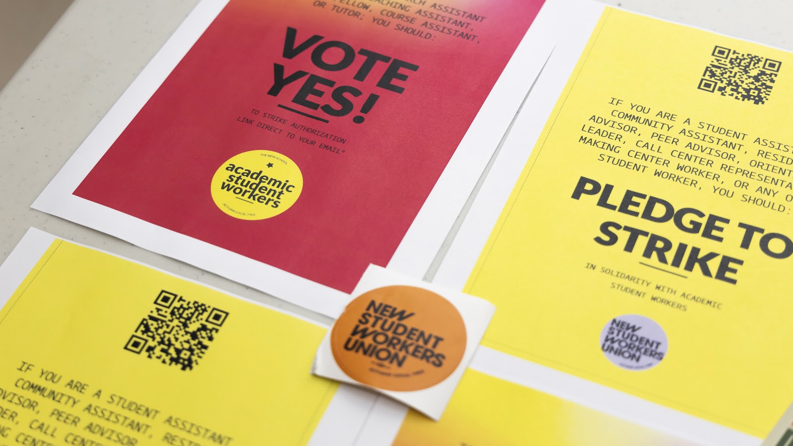 Red and yellow fliers with the words “VOTE YES!” and “PLEDGE TO STRIKE.”