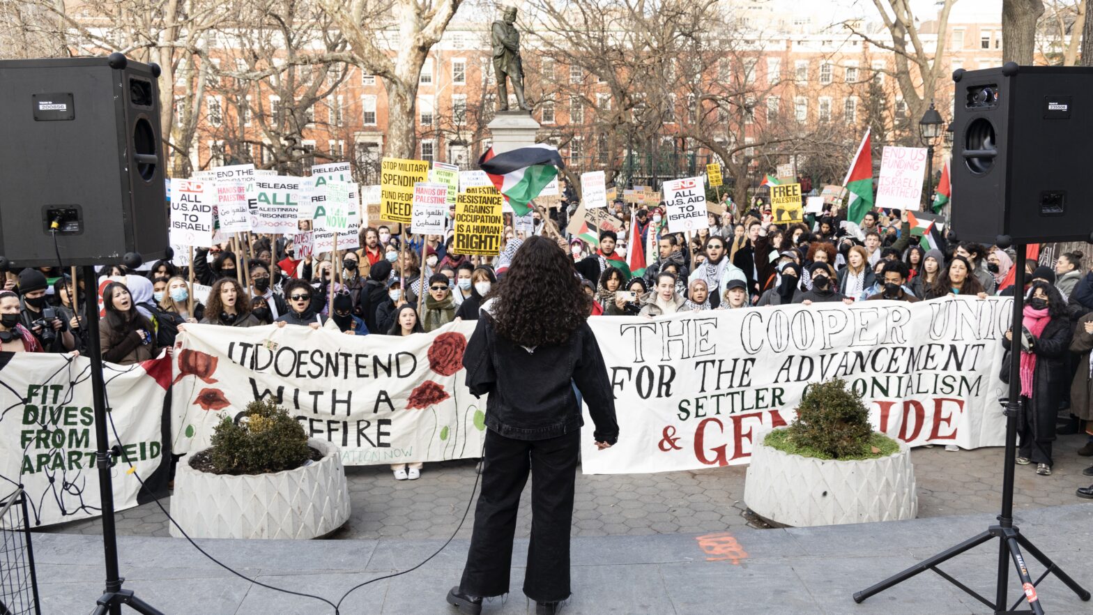 speaker in front of a crowd in Washington Square Park