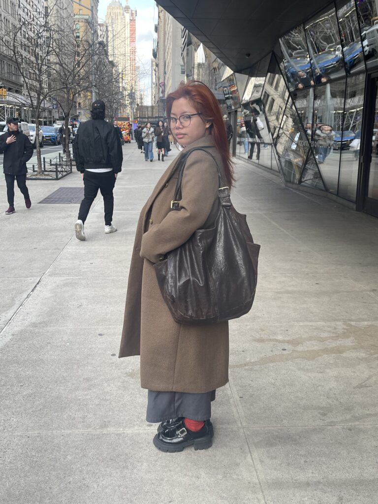 Rachel posing with her vintage Dolce & Gabbana bag.