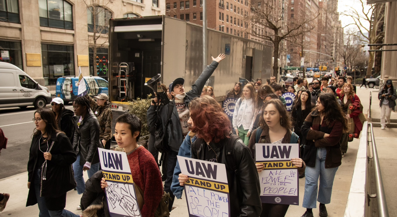 Students and Union members march at “practice picket”