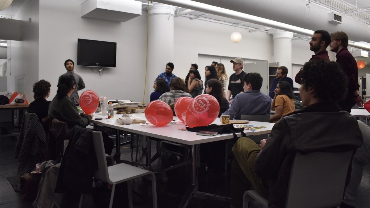 Union members gather around tables at a January union event.