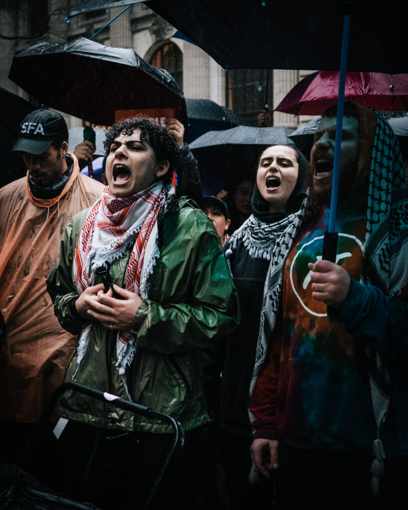 Protesters yelling in the rain
