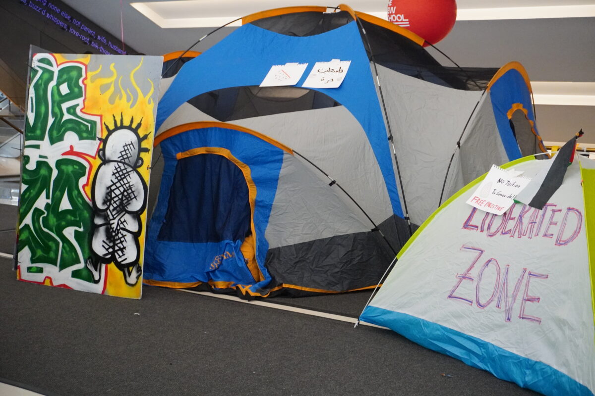 Tents and multicolored signs set up in U.C. lobby