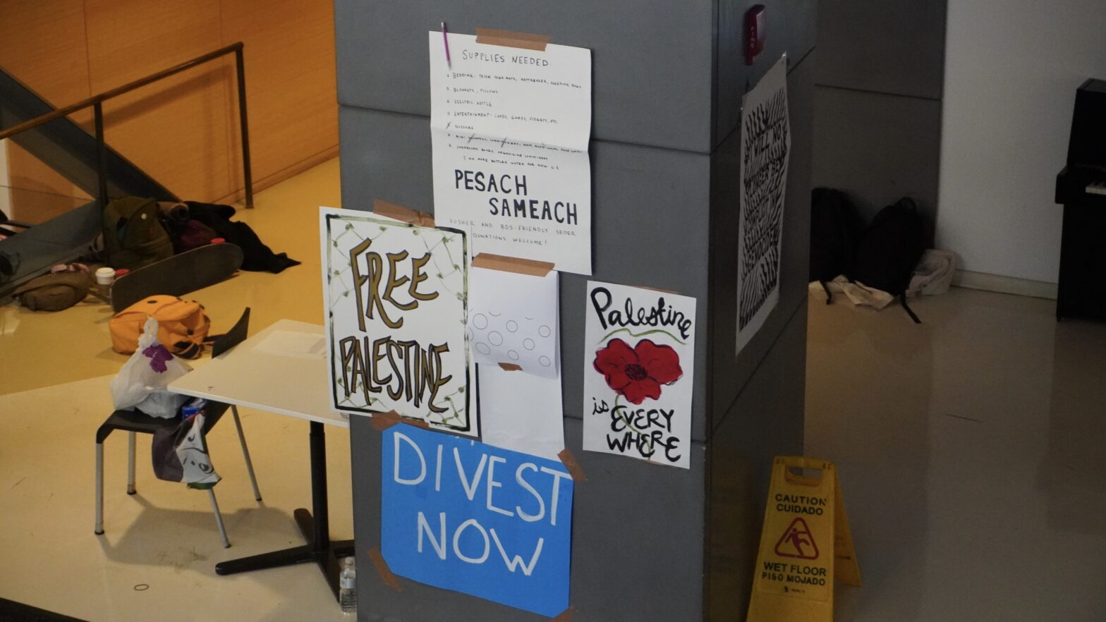 posters hung on a pillar in the University Center