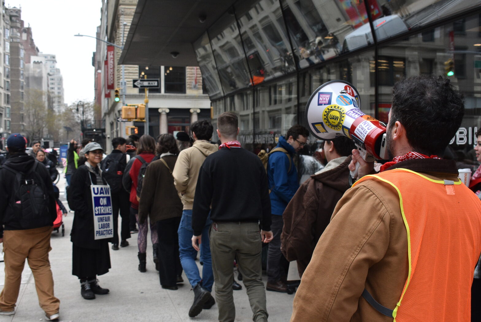 Students and union members picket in front of the UC