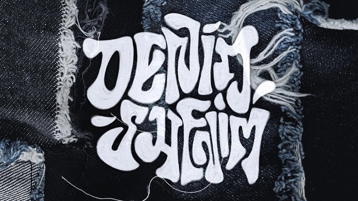 White bubble text that reads “Denim Shenim” against patchwork denim background