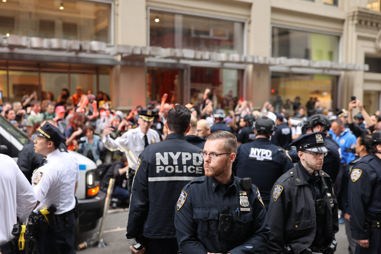 NYPD watches over crowd of protestors in front of Parsons building on 13th street