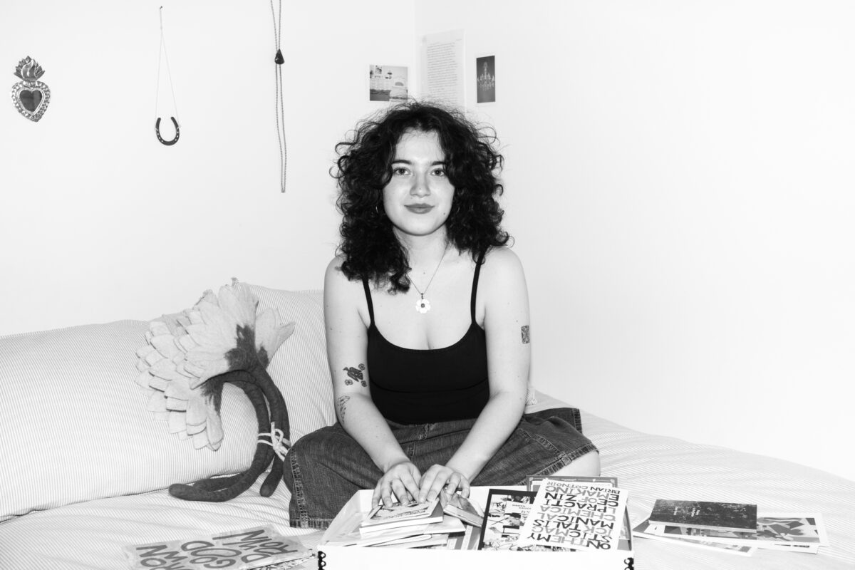 A monochromatic photo of a girl looking at the camera.