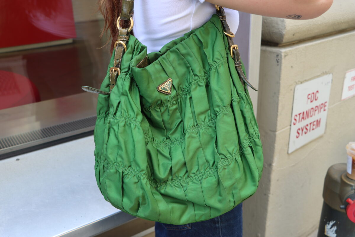 Close-up of student’s green Prada bag.