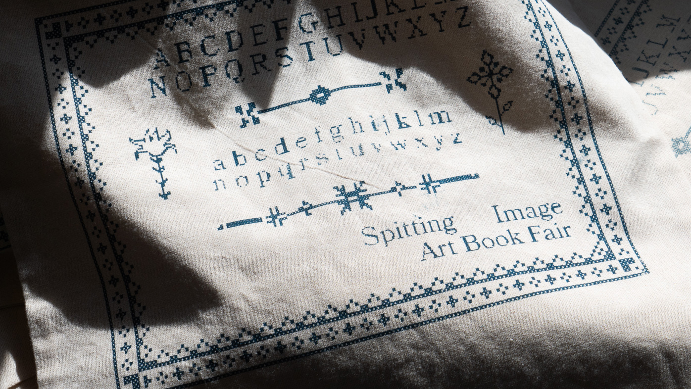 A tote bag enveloped with light and shadow.