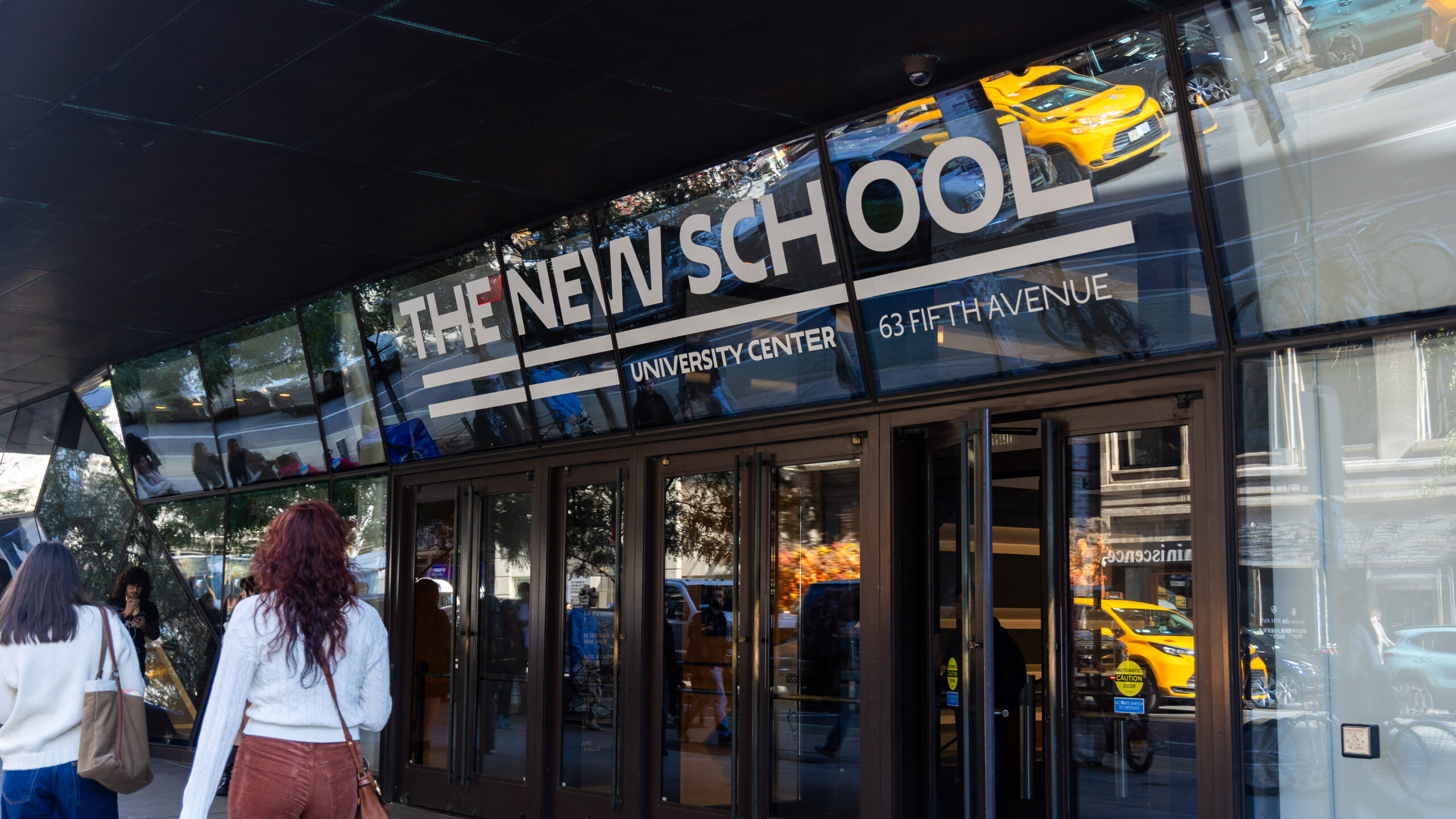 Photo of a building entrance with text that reads “The New School University Center 63 fifth avenue.”