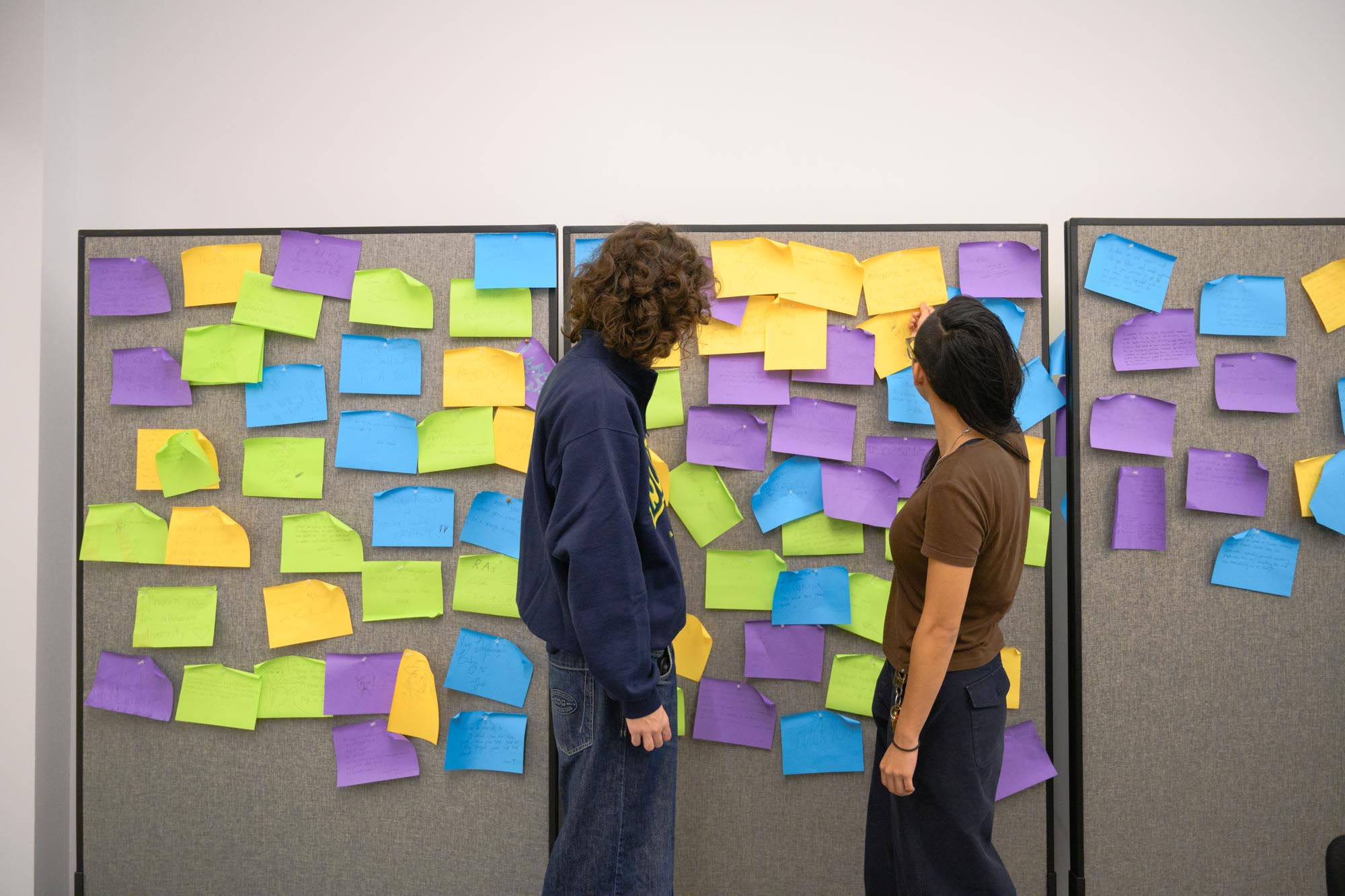 Photograph of USS Chair Emily Li and Vice Chair Ryder Glickman discussing suggestions submitted by the community.