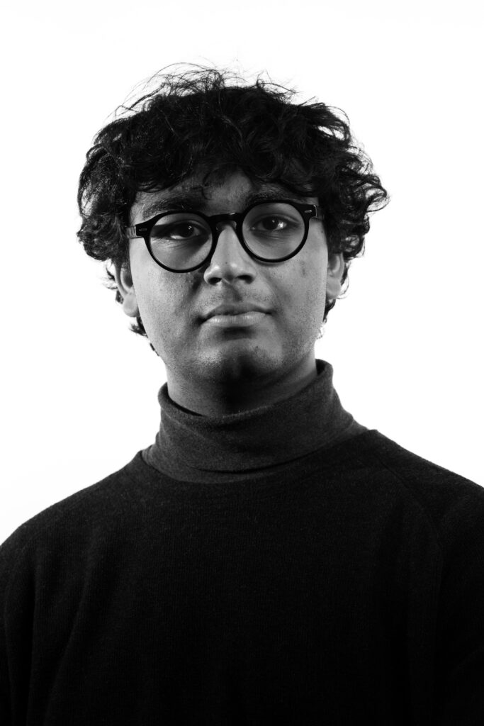 Headshot of Ayden Bhagwati, black and white, on white background 