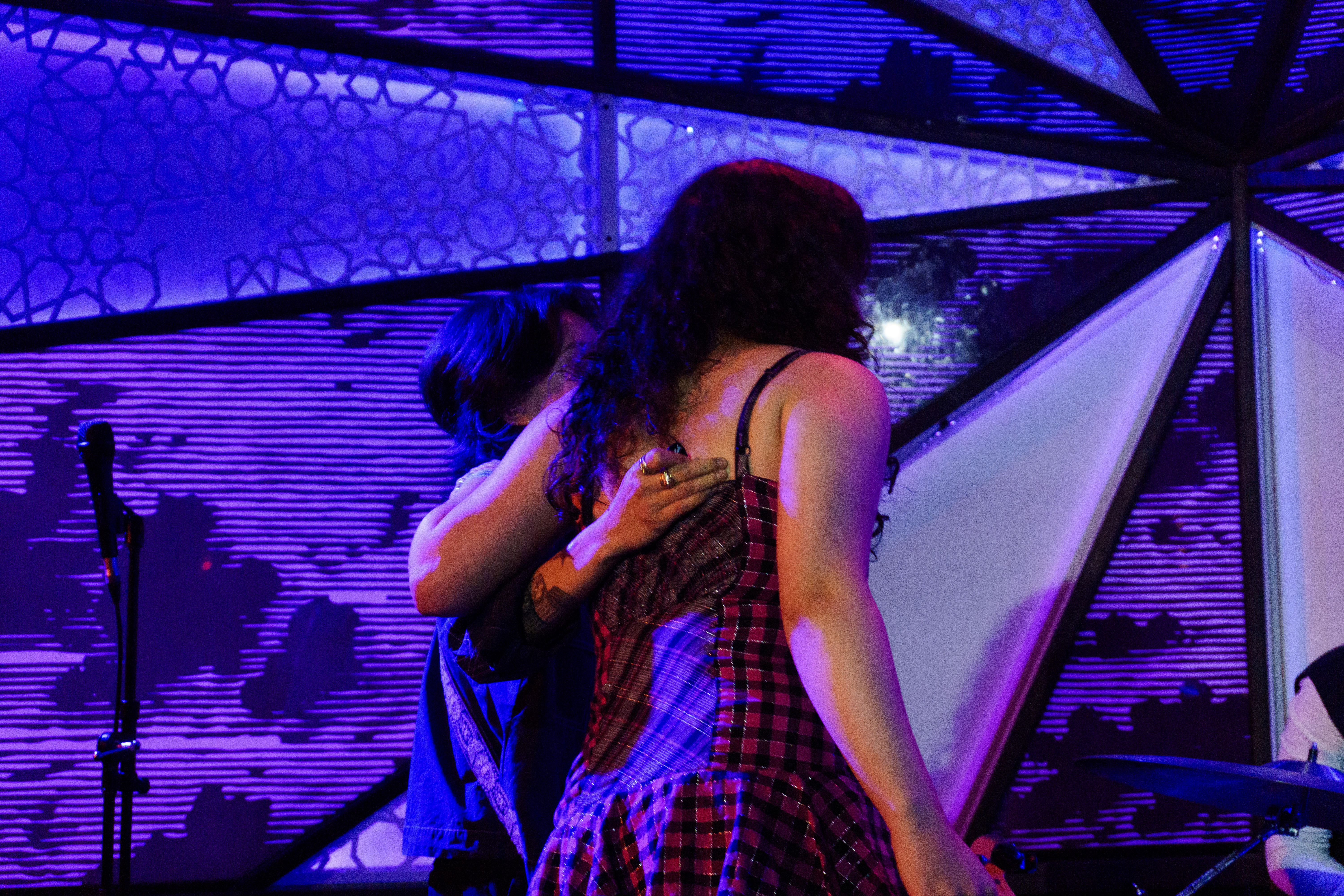 Nido and Lipkin hugging on stage.